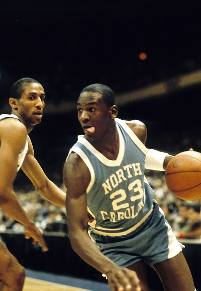 North Carolina Tar Heels guard Michael Jordan (23) in action against Duke Blue Devils guard Tommy Amaker (4) during the ACC tournament at Greensboro Coliseum. Duke defeated North Carolina 77-75.